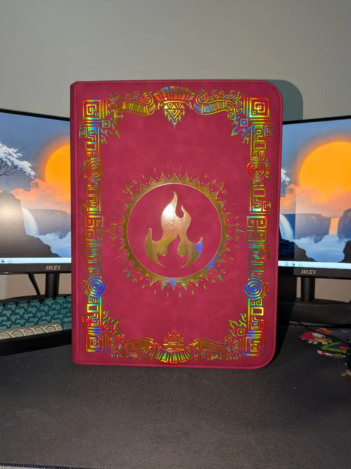 Sunfire binder on a desk with reflected light on the foil