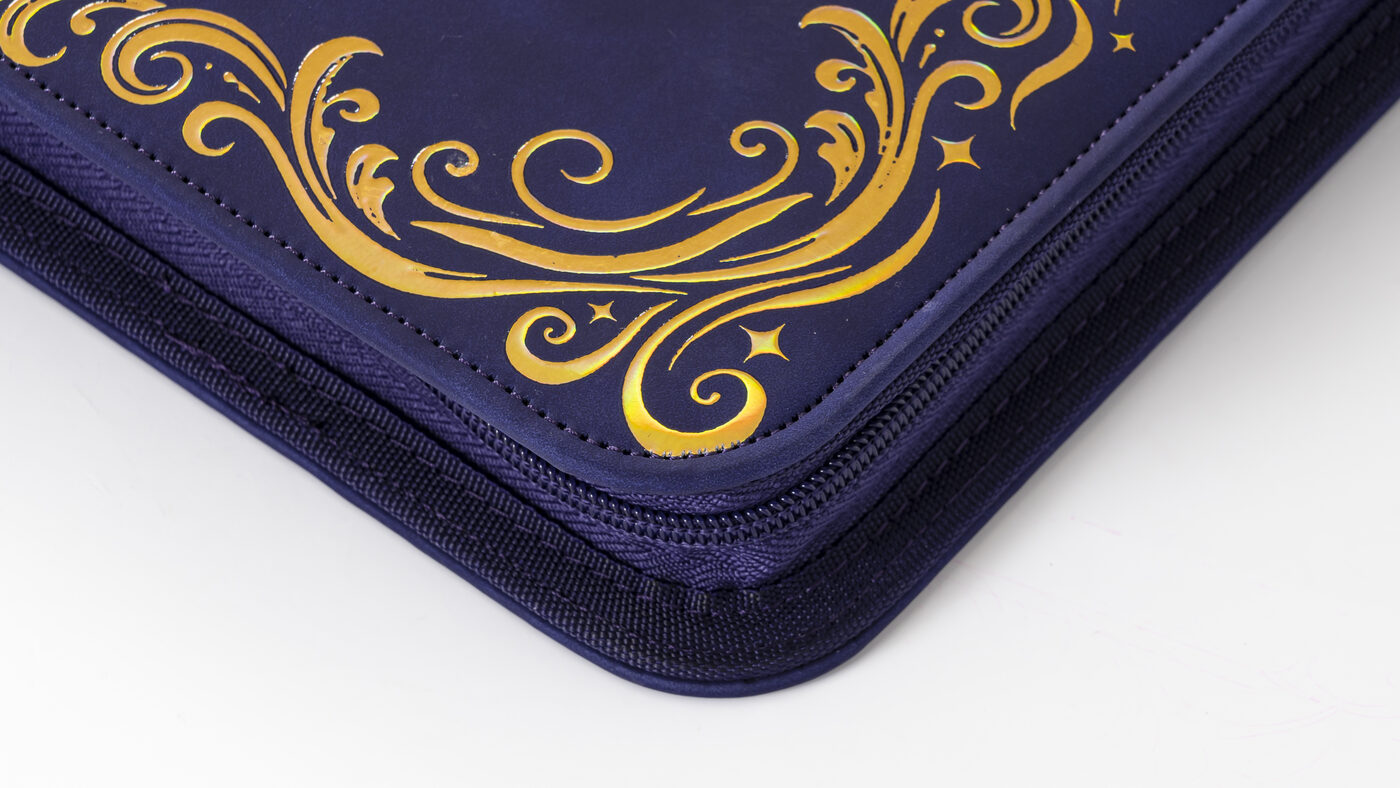 Close view of the Astral Vision binder's stitched edge and textured exterior