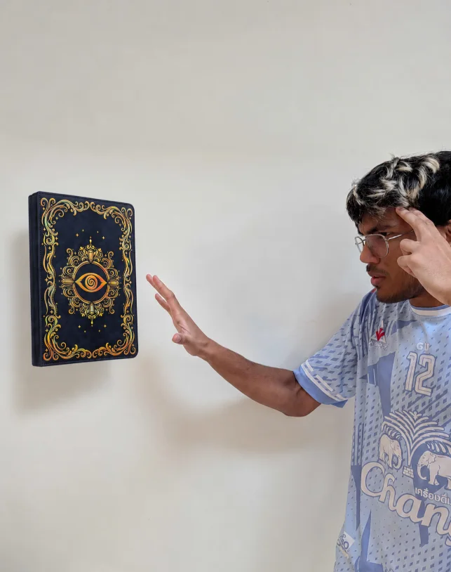 Adi pretending to levitate the Astral Vision binder